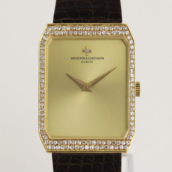 Vacheron Constantin 18ct Yellow Gold Manual Watch with Diamond Bezel; gold colour dial, original diamond bezel and diamond on dial at the centre of the Vacheron Constantin logo, on a Vacheron Constantin dark brown leather strap