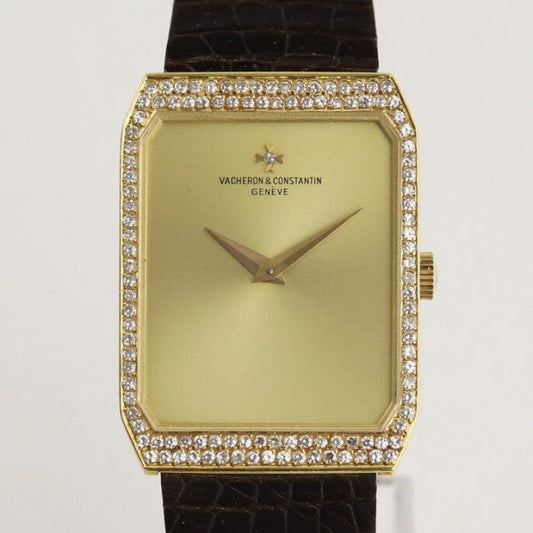 Vacheron Constantin 18ct Yellow Gold Manual Watch with Diamond Bezel; gold colour dial, original diamond bezel and diamond on dial at the centre of the Vacheron Constantin logo, on a Vacheron Constantin dark brown leather strap