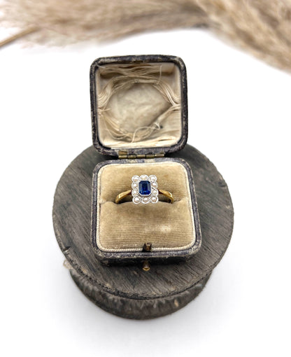 A sapphire and pearl cluster ring in yellow gold and platinum, in an antique ring box
