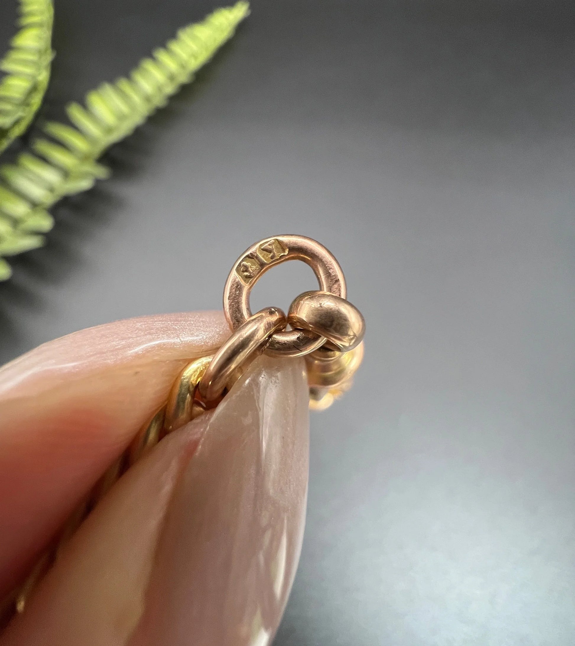 A 1923 date stamp on a yellow gold end ring