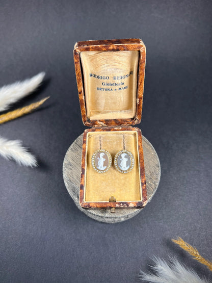 A pair of yellow gold oval shell cameo earrings, in an antique box