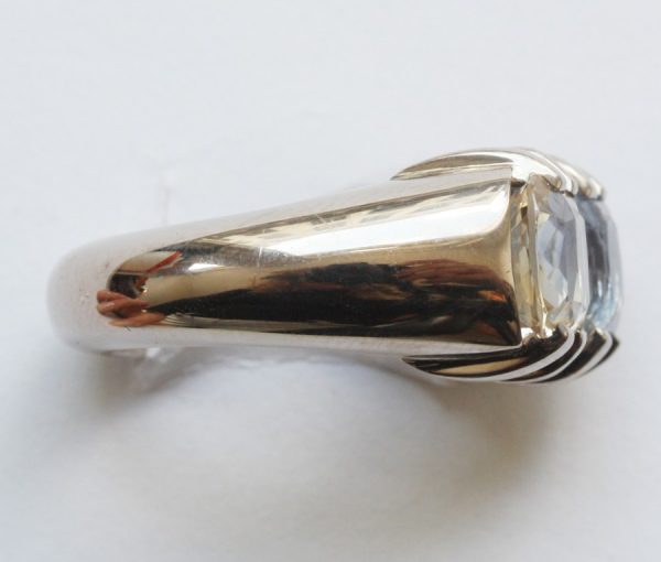 Blue and Yellow Cushion Cut Sapphire and 18ct Grey Gold Heavy Dress Ring; set with a 2.80ct light blue sapphire and 2.73ct yellow sapphire