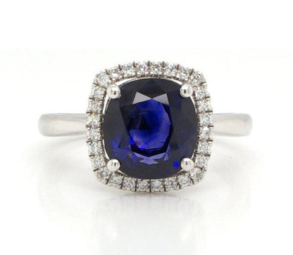 Cushion Cut 3.53ct Sapphire and Diamond Cluster Ring, four-claw set, on a plain platinum shank.