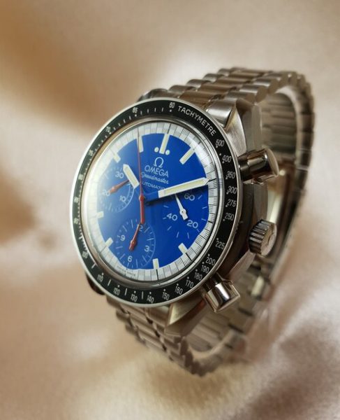 Omega Speedmaster Schumacher Automatic Watch; 39mm steel case, blue and white surround dial, chronograph, Hesalite crystal, steel bracelet strap, with papers, 2006