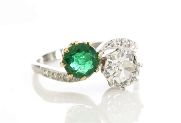 Natural Colombian Emerald and Diamond Crossover Ring in Platinum; set with 1.00ct natural emerald and 1.50ct old cut diamond, diamond set shoulders