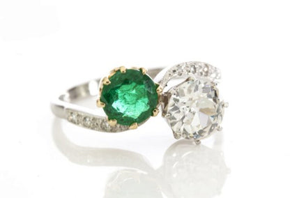Natural Colombian Emerald and Diamond Crossover Ring in Platinum; set with 1.00ct natural emerald and 1.50ct old cut diamond, diamond set shoulders