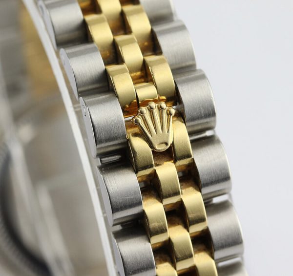 Rolex Lady Datejust Steel and Gold 179173 Automatic; 26mm case with Rolex factory original diamond dial, on a steel and gold Jubilee bracelet with Crownclasp, with Rolex box and papers, Circa 2011