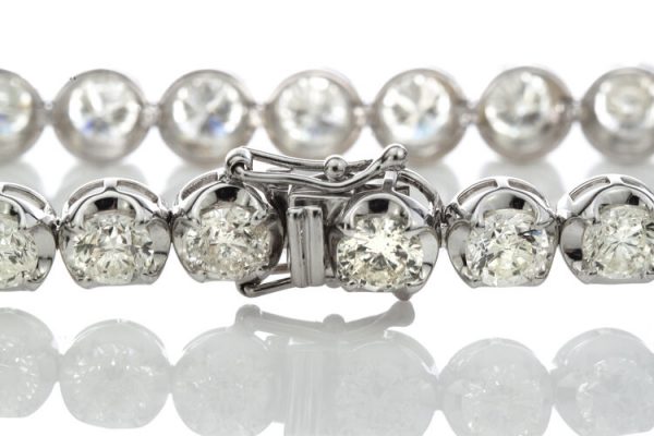 Vintage Diamond Tennis Bracelet, set with 23 round brilliant-cut diamonds, 23.00 carat total, mounted in 18ct white gold. Circa 1970's