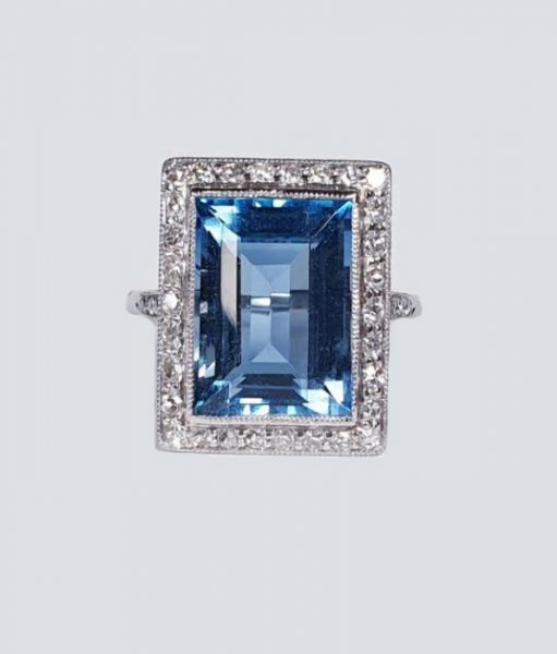 Art Deco 7ct Aquamarine and Diamond Cluster Dress Ring; rectangular Santa Maria aquamarine surrounded by diamonds, with diamond set shoulders, in platinum