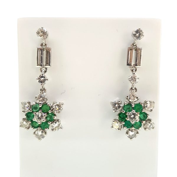 Emerald and Diamond Cluster Drop Earrings; floral clusters of emeralds and diamonds suspended from brilliant and baguette-cut diamond-set drops, 2.00 carat total, in 18ct white gold