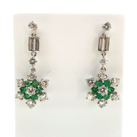 Emerald and Diamond Cluster Drop Earrings; floral clusters of emeralds and diamonds suspended from brilliant and baguette-cut diamond-set drops, 2.00 carat total, in 18ct white gold