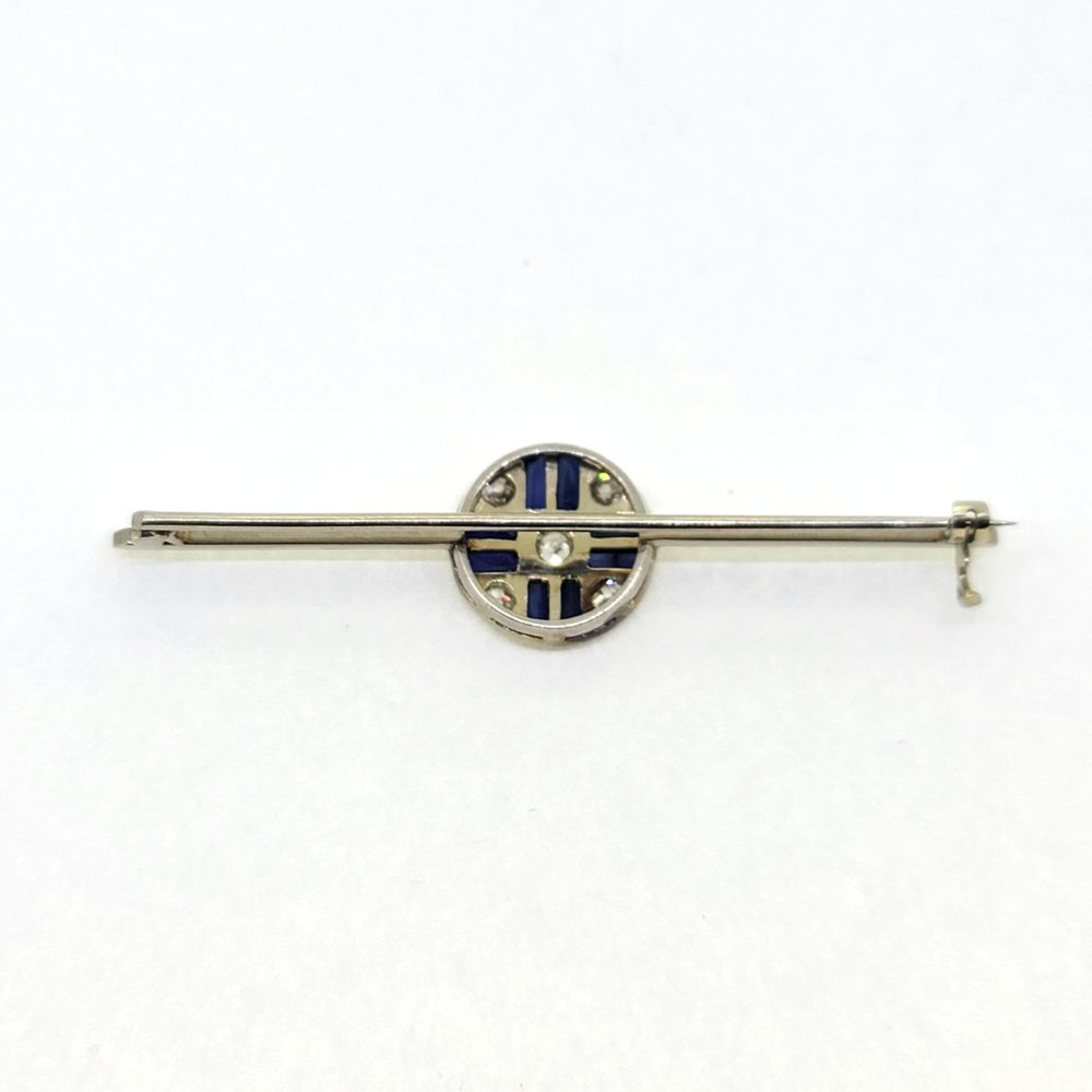 Sapphire and Diamond Bar Brooch in Platinum, elegant platinum bar brooch set with a central circular sapphire and diamond cluster