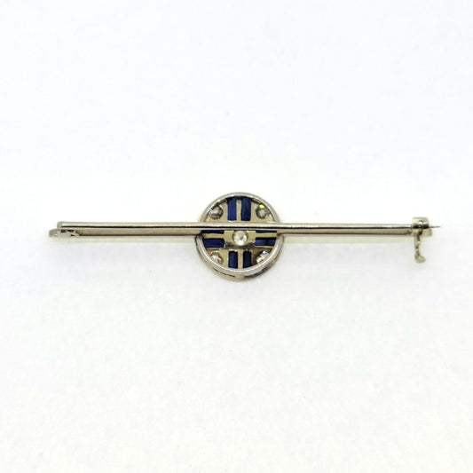 Sapphire and Diamond Bar Brooch in Platinum, elegant platinum bar brooch set with a central circular sapphire and diamond cluster
