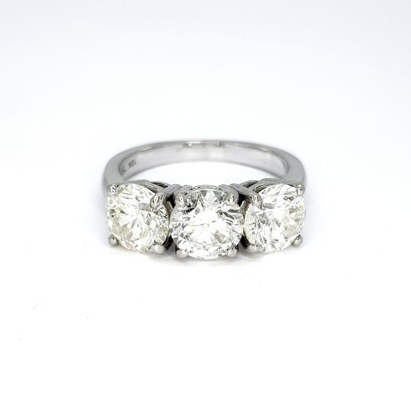 Diamond Three Stone Ring in 18ct White Gold, 3.73 carat total, central 1.30 carat round brilliant-cut diamond flanked by diamonds totalling an additional 2.43 carats