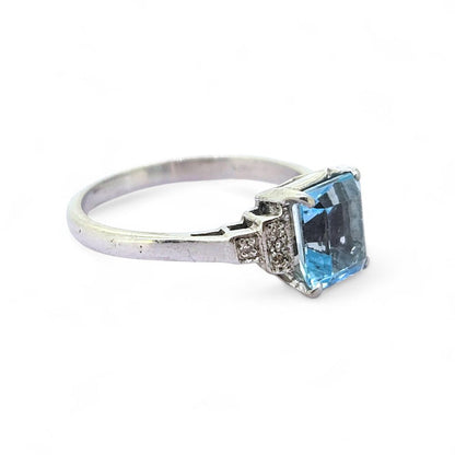 Aquamarine and Diamond Engagement Ring, rectangular step-cut aquamarine flanked by stepped brilliant-cut diamond-set shoulders in 18ct white gold