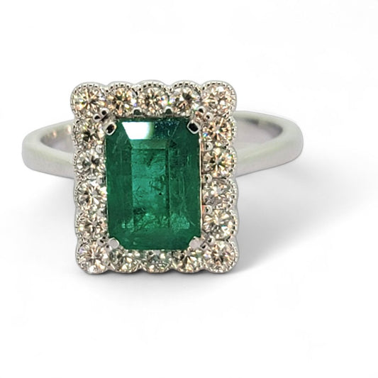 2ct Emerald and Diamond Cluster Engagement Ring, 2.12ct emerald-cut emerald surrounded by rectangular border of sparkling diamonds in 18ct white gold