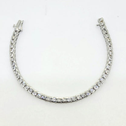 Modern 6.60ct Diamond Line Bracelet in 14ct White Gold, 6.60 carats of round brilliant-cut diamonds in individual bezel settings creating a seamless articulated design