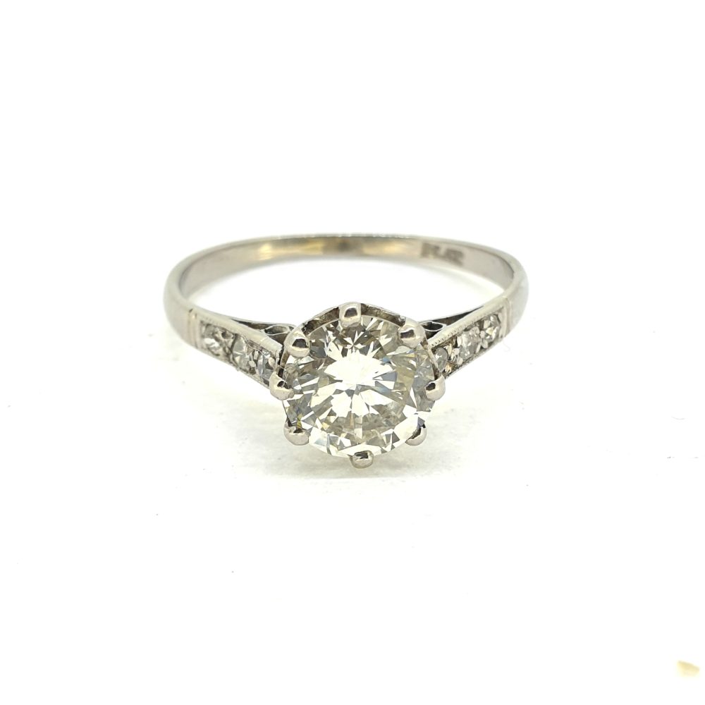 Timeless Single Stone 1.30ct Diamond Solitaire Engagement Ring in Platinum with diamond-set shoulders
