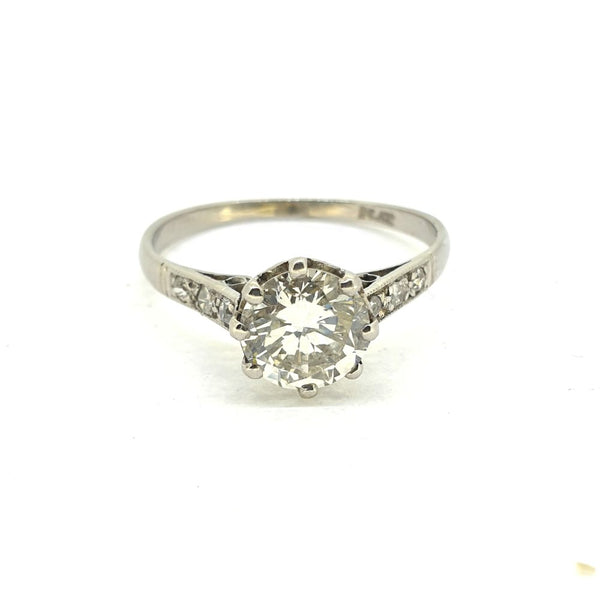Timeless Single Stone 1.30ct Diamond Solitaire Engagement Ring in Platinum with diamond-set shoulders