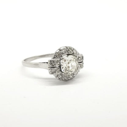 Vintage French Old Cut Diamond Cluster Ring in Platinum; central 0.90 carat old-cut diamond is claw set within a diamond surround which details at the shoulders