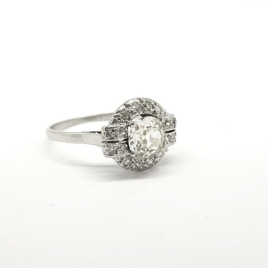 Vintage French Old Cut Diamond Cluster Ring in Platinum; central 0.90 carat old-cut diamond is claw set within a diamond surround which details at the shoulders