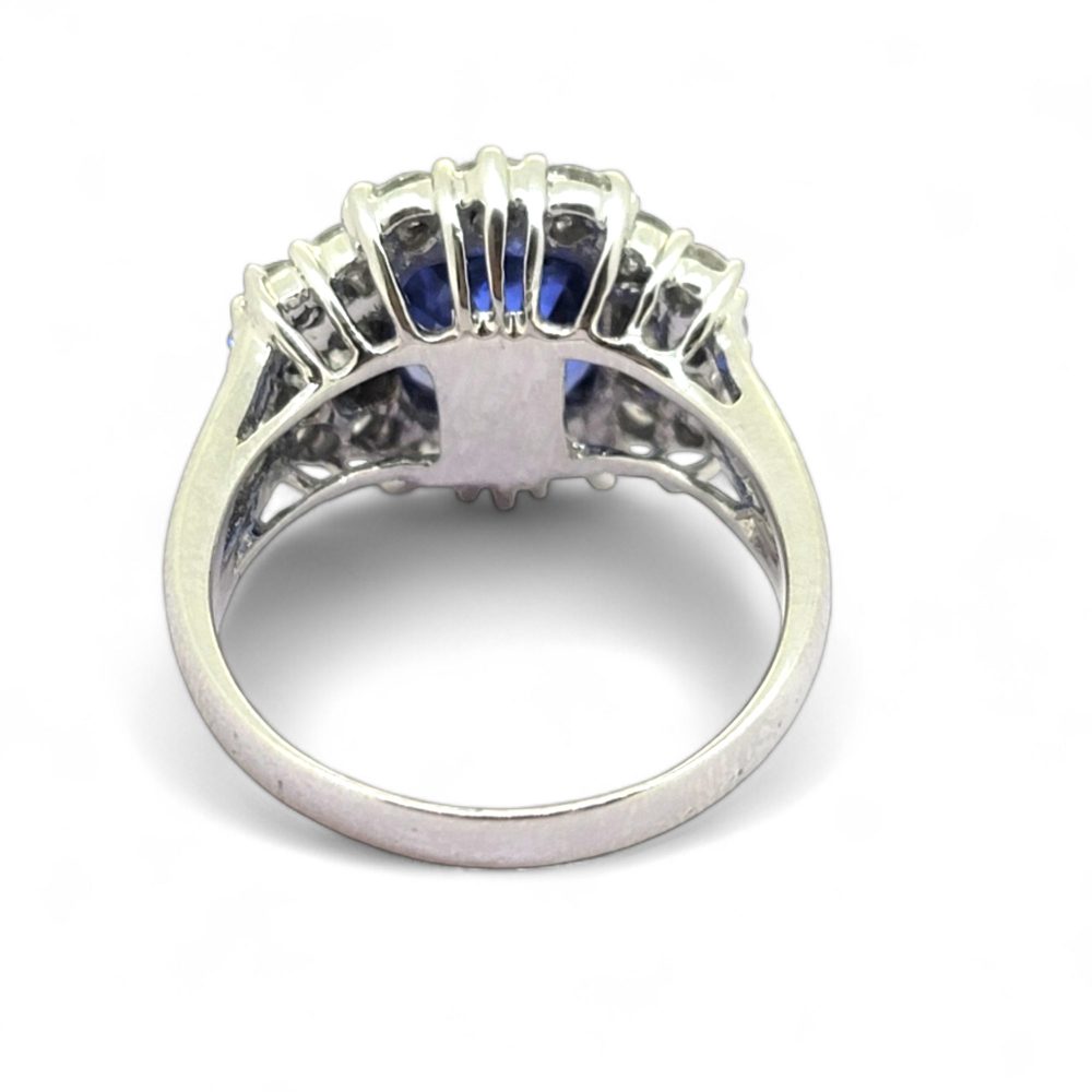 Oval Cushion Shaped Sapphire and Diamond Cluster Engagement Ring in 18ct white gold with split shoulders