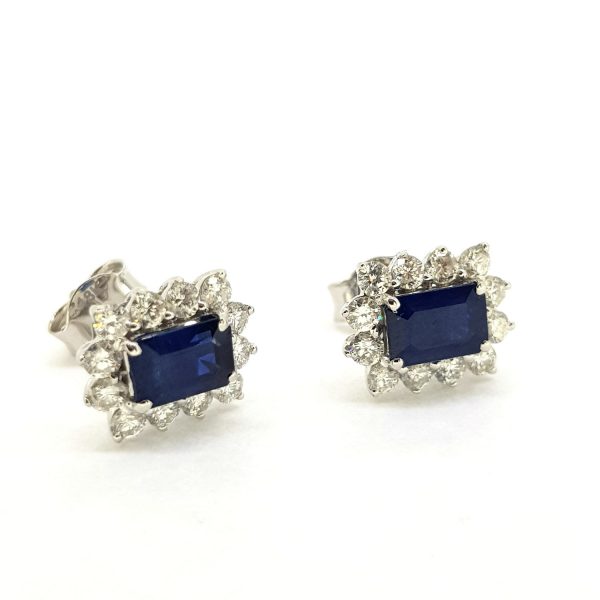 Sapphire and Diamond Cluster Earrings; featuring 1.51cts emerald-cut sapphires surrounded by 0.70cts diamonds, in 18ct white gold