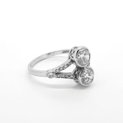 Toi et Moi Diamond Two Stone Ring; two main collet-set diamonds accented with diamond-set split shoulders, 1.60 carat total, in 18ct white gold