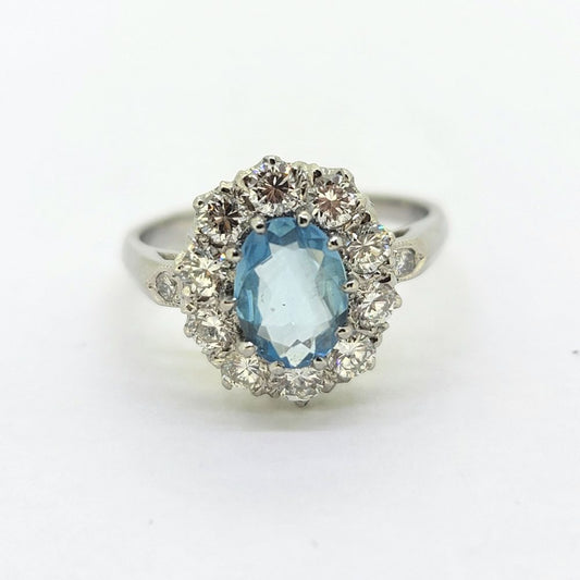Oval Aquamarine and Diamond Cluster Engagement Ring