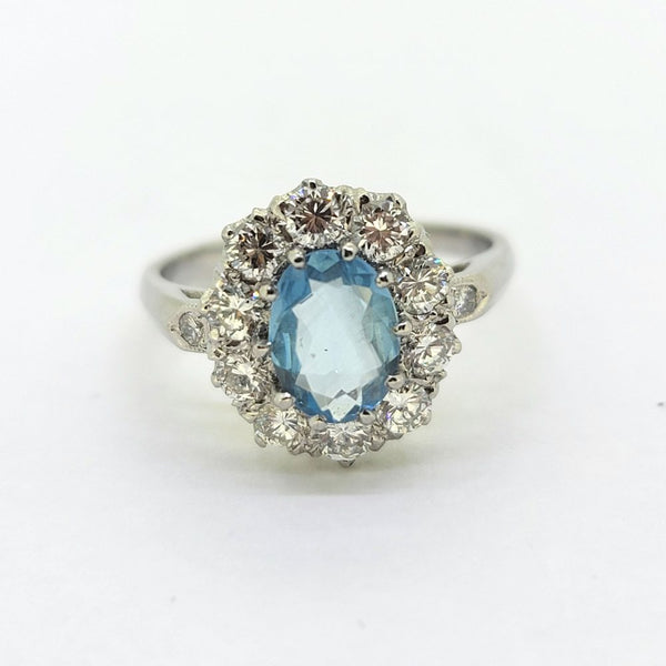 Oval Aquamarine and Diamond Cluster Engagement Ring