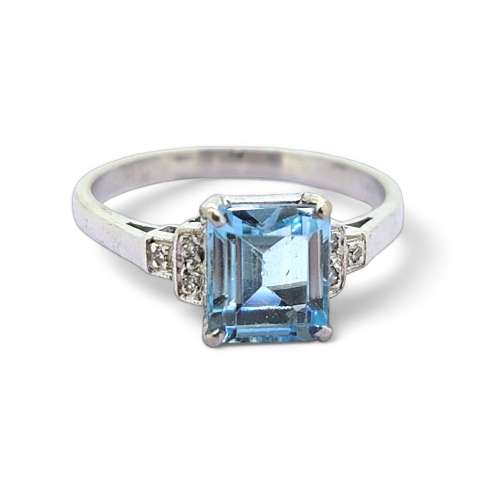Aquamarine and Diamond Engagement Ring, rectangular step-cut aquamarine flanked by stepped brilliant-cut diamond-set shoulders in 18ct white gold