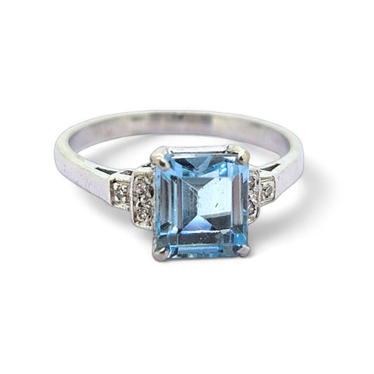 Aquamarine and Diamond Engagement Ring, rectangular step-cut aquamarine flanked by stepped brilliant-cut diamond-set shoulders in 18ct white gold