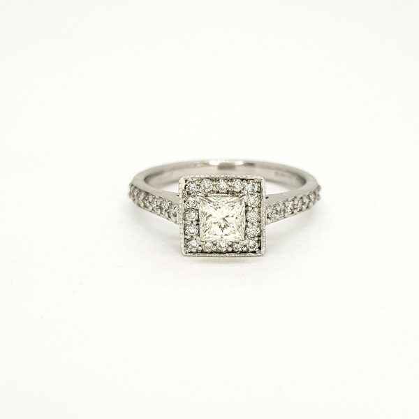 Princess Cut Diamond Cluster Ring; central 0.52 carat princess-cut diamond within a diamond set surround with diamond set shoulders, in 18ct white gold