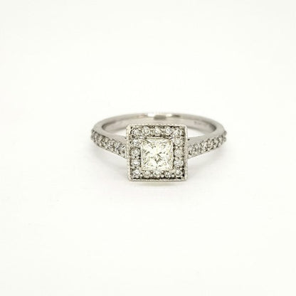 Princess Cut Diamond Cluster Ring; central 0.52 carat princess-cut diamond within a diamond set surround with diamond set shoulders, in 18ct white gold