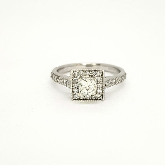 Princess Cut Diamond Cluster Ring; central 0.52 carat princess-cut diamond within a diamond set surround with diamond set shoulders, in 18ct white gold
