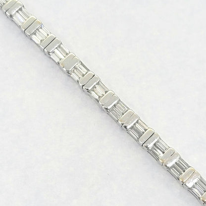 Vintage 4.50ct Baguette Cut Diamond Line Tennis Bracelet, 37 links each set with two baguette-cut diamonds in 18ct White Gold