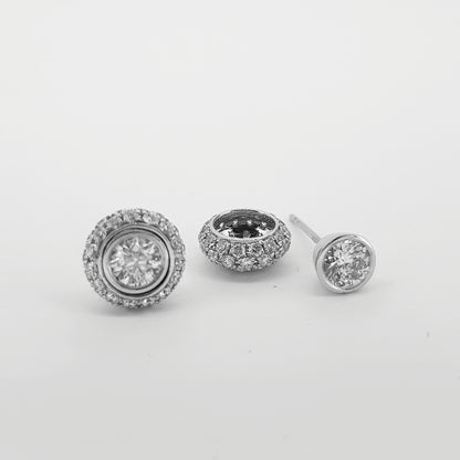 A pair of diamond round cluster earrings in white gold