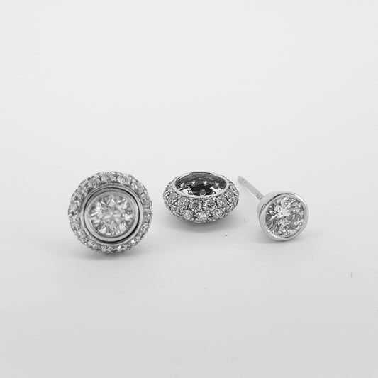 A pair of diamond round cluster earrings in white gold