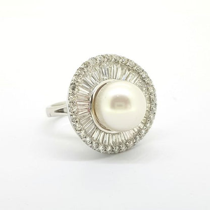 South Sea Pearl and Diamond Cluster Ballerina Ring; A beautiful South Sea pearl is dressed with a 'Tutu' of baguette and brilliant cut diamonds, 18ct white gold