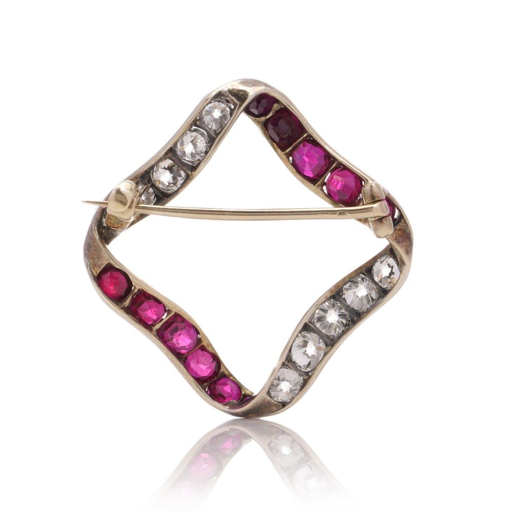 Late Victorian Antique Burma Ruby and Old Cut Diamond Ribbon Brooch, late Victorian 15ct gold ribbon brooch set with Burma rubies and old European-cut diamonds. Circa 1900