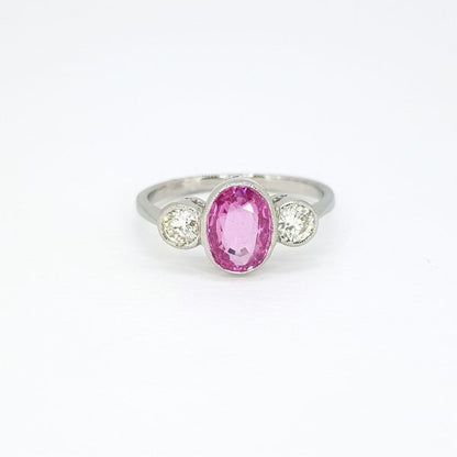 1.35ct Oval Cut Pink Sapphire and Diamond Three Stone Ring in Platinum