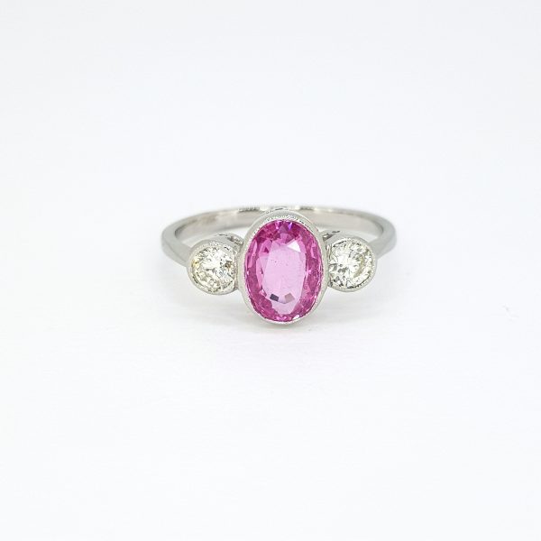 1.35ct Oval Cut Pink Sapphire and Diamond Three Stone Ring in Platinum