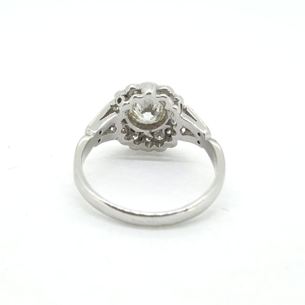 Diamond Daisy Flower Cluster Ring, 1.60 carat total, central 1ct diamond set within diamond surround in 18ct white gold with diamond-set split shoulders