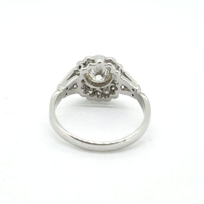 Diamond Daisy Flower Cluster Ring, 1.60 carat total, central 1ct diamond set within diamond surround in 18ct white gold with diamond-set split shoulders