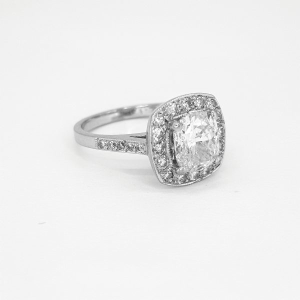 1.70ct Diamond Cluster Ring in 18ct White Gold; central 1.70 carat oval-cut diamond within a diamond surround with diamond set shoulders, in 18ct white gold