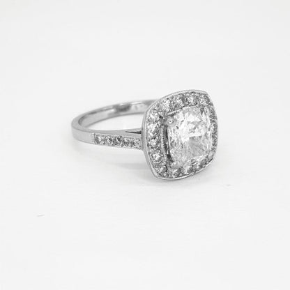 1.70ct Diamond Cluster Ring in 18ct White Gold; central 1.70 carat oval-cut diamond within a diamond surround with diamond set shoulders, in 18ct white gold