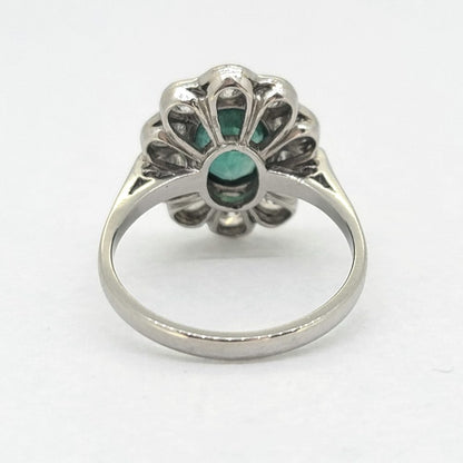 Modern Emerald and Diamond Floral Cluster Engagement Ring in Platinum