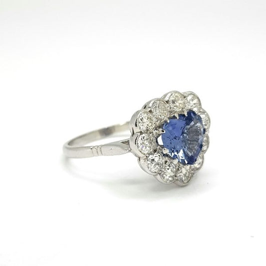 Vintage Sapphire and Diamond Heart Cluster Ring; claw-set 1.53ct heart-shaped sapphire surrounded with 0.90cts collet-set brilliant-cut diamonds, in 18ct white gold