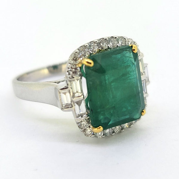 5.28ct Emerald and Diamond Cluster Engagement Ring, 5.28ct emerald-cut emerald surrounded by brilliant and baguette cut diamonds in 18ct white gold