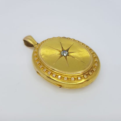 Antique 15ct Gold Locket Pendant with Old Cut Diamond; 15ct yellow gold oval locket set with a central old-cut diamond within a star design